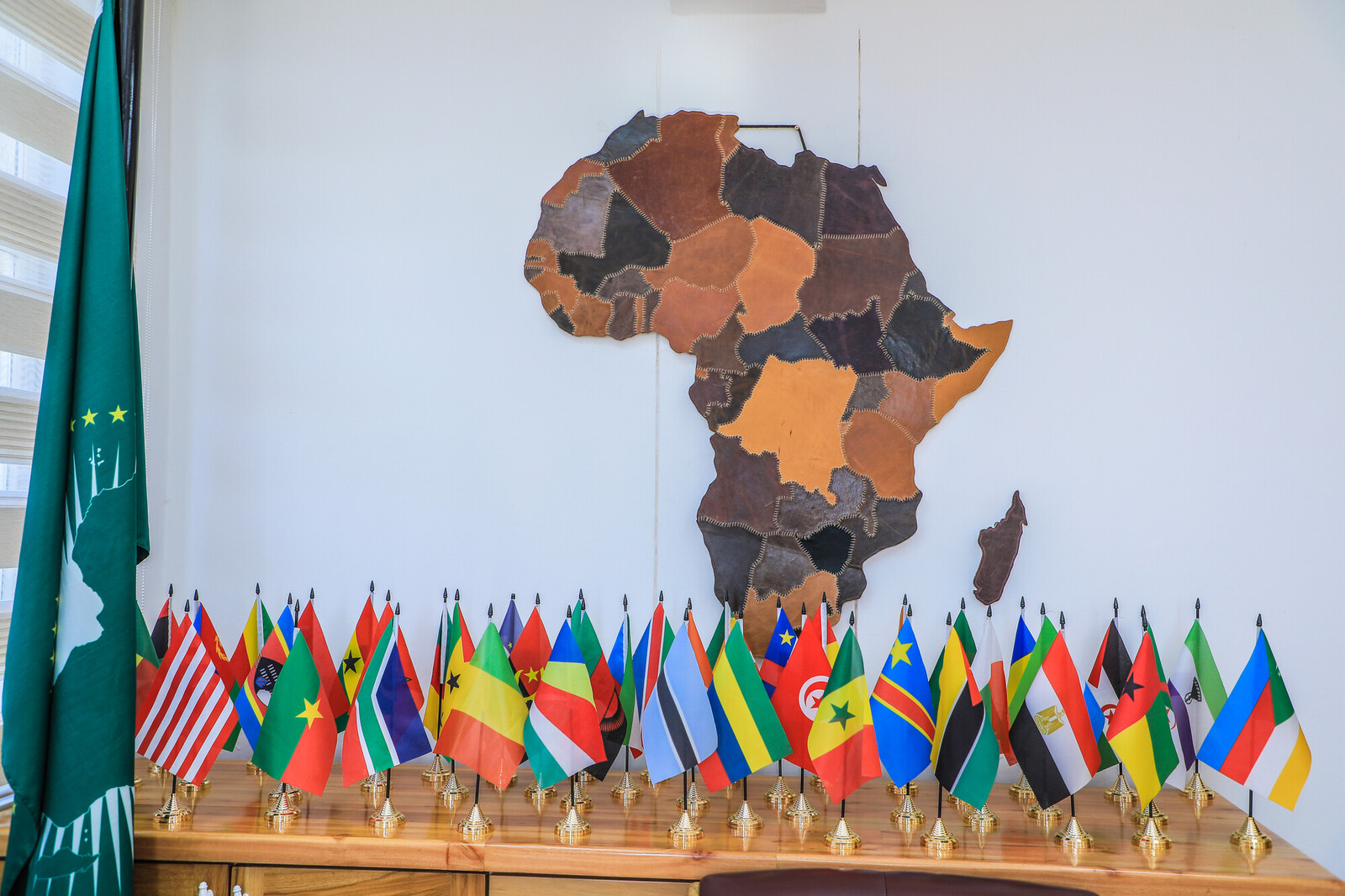 a table filled with the different flags of African countries