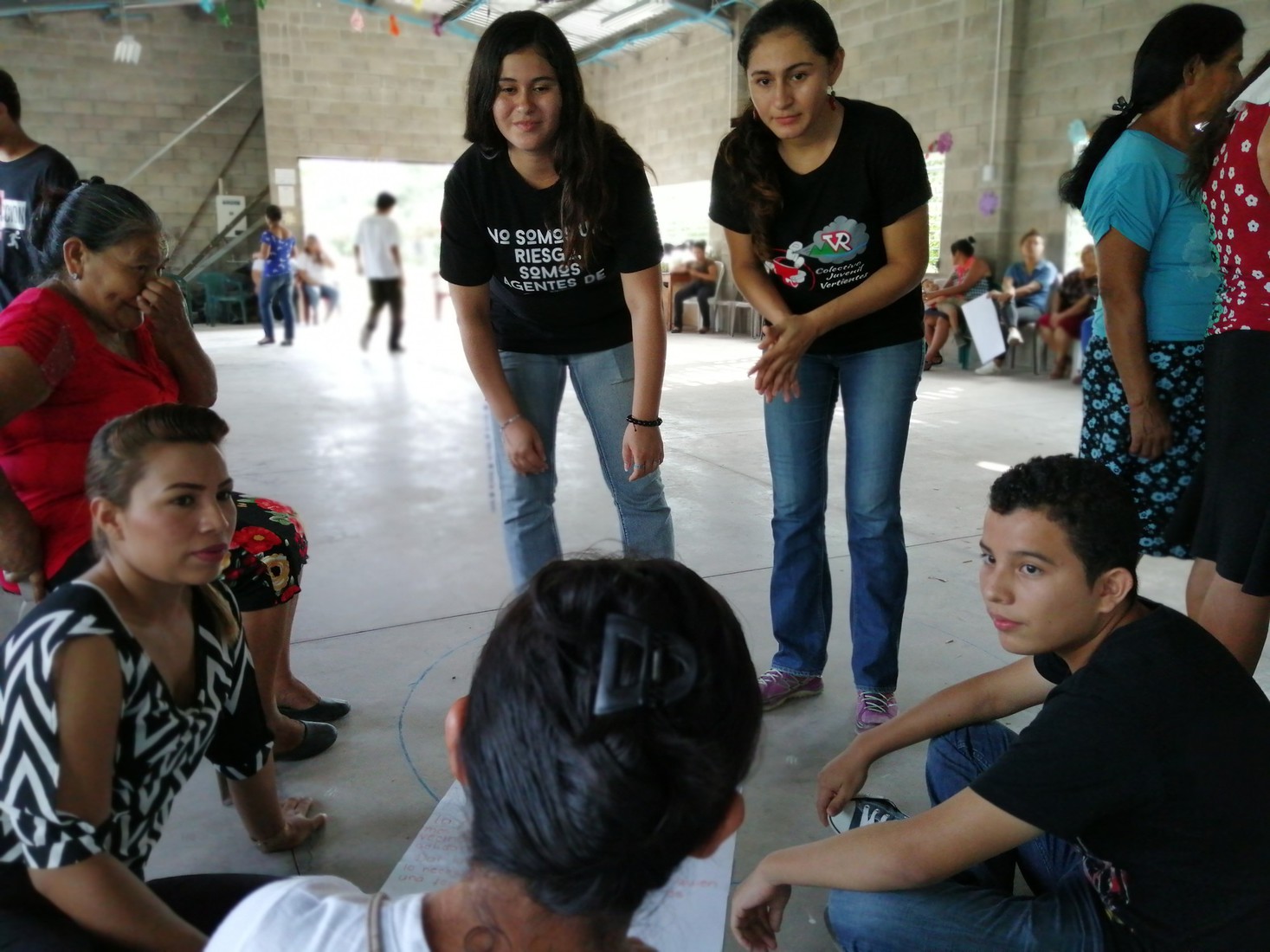 A group of young people discussing in a circle during a peace festival