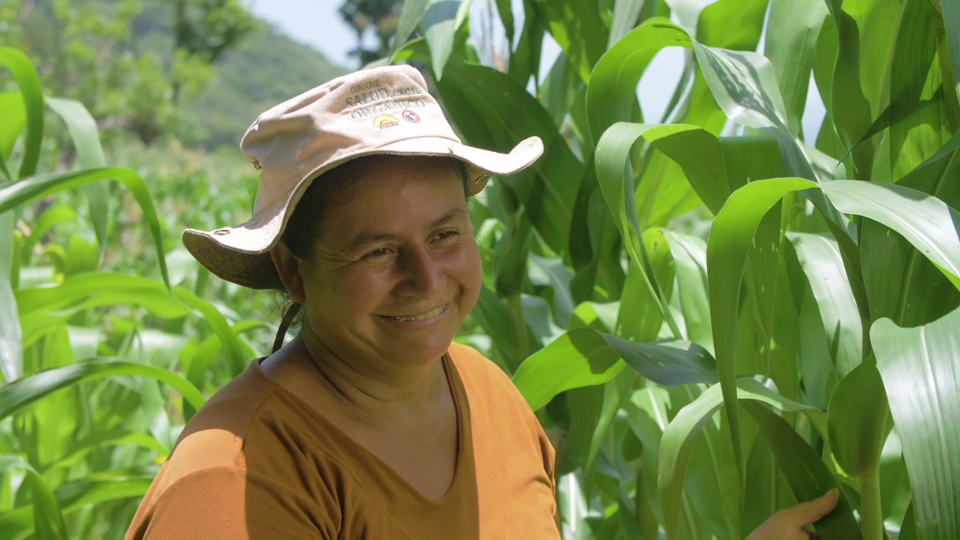 Smiling woman standing in a farm