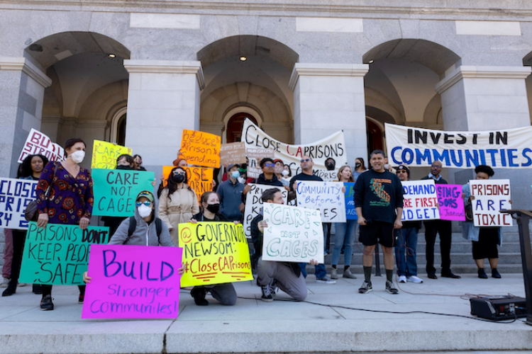 rally with people holding signs