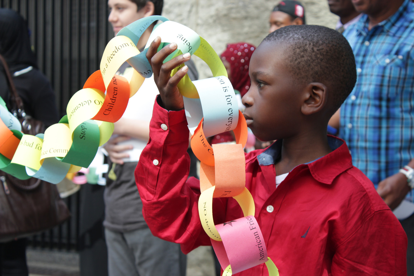 Child holding paper chain