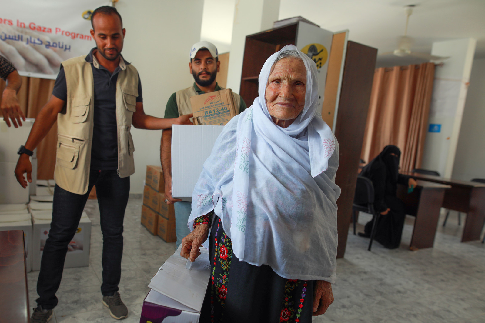 Gaza elder receiving aide