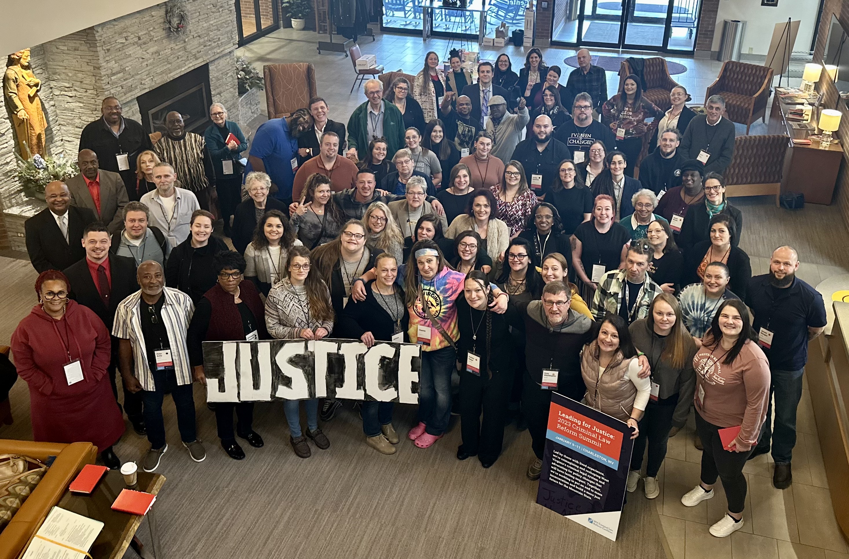 Picture of a large group with a banner reading 'Justice'