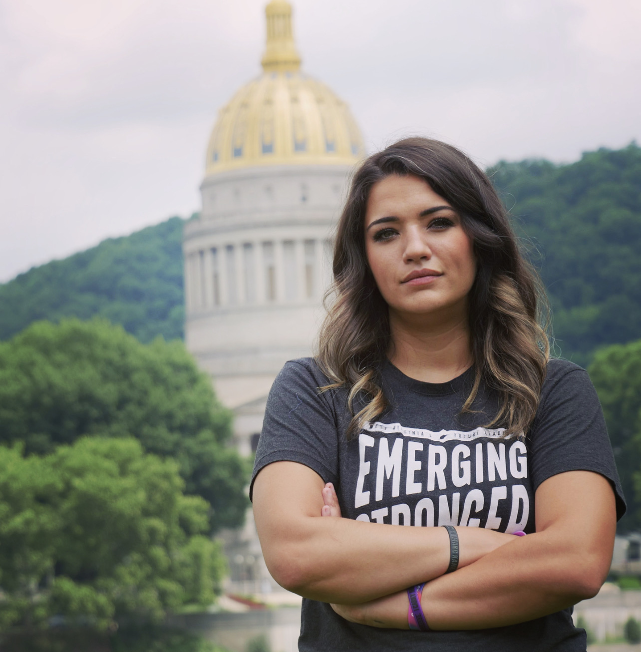 Picture of a woman in front of the West Virginia capitol building