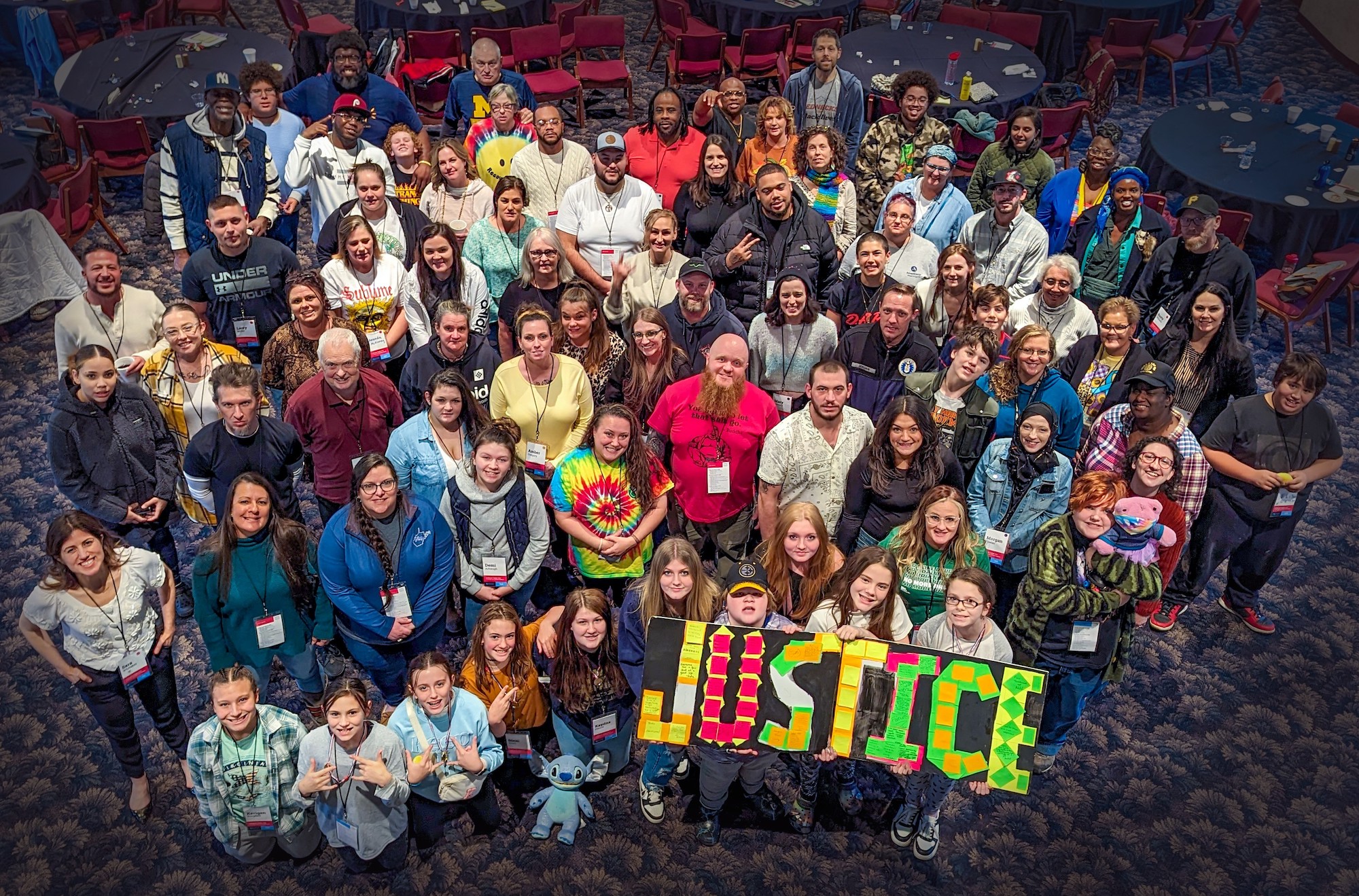 Picture of a large group from above at the Leading for Justice Conference