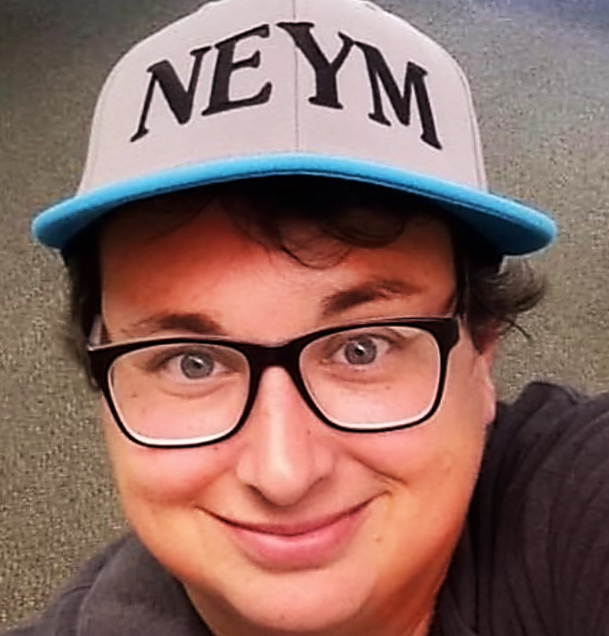 Picture of a person with glasses and a 'NEYM' hat