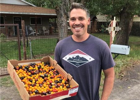 A New Mexico farmer and cherry tomatoes
