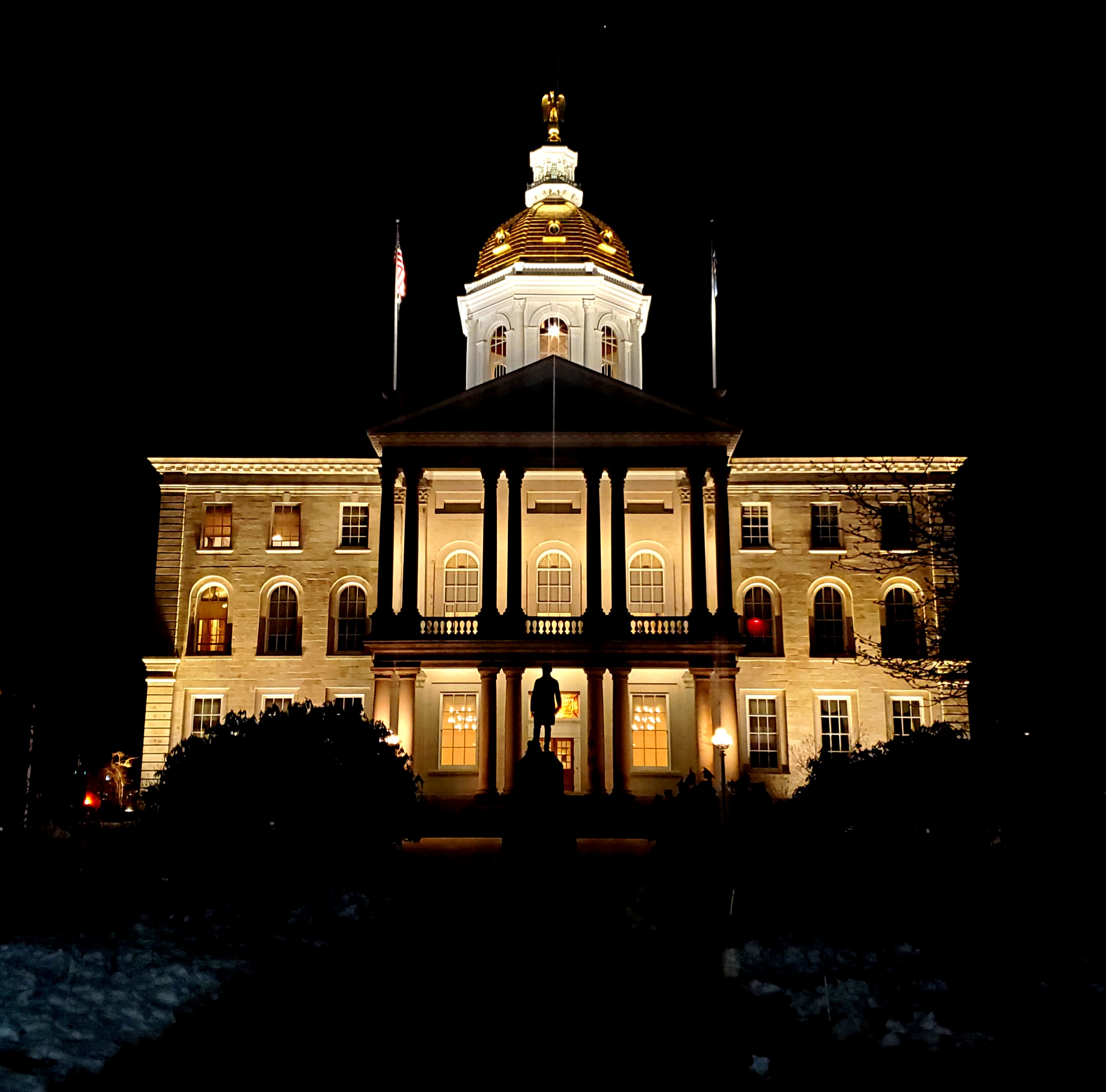 NH State House at night 