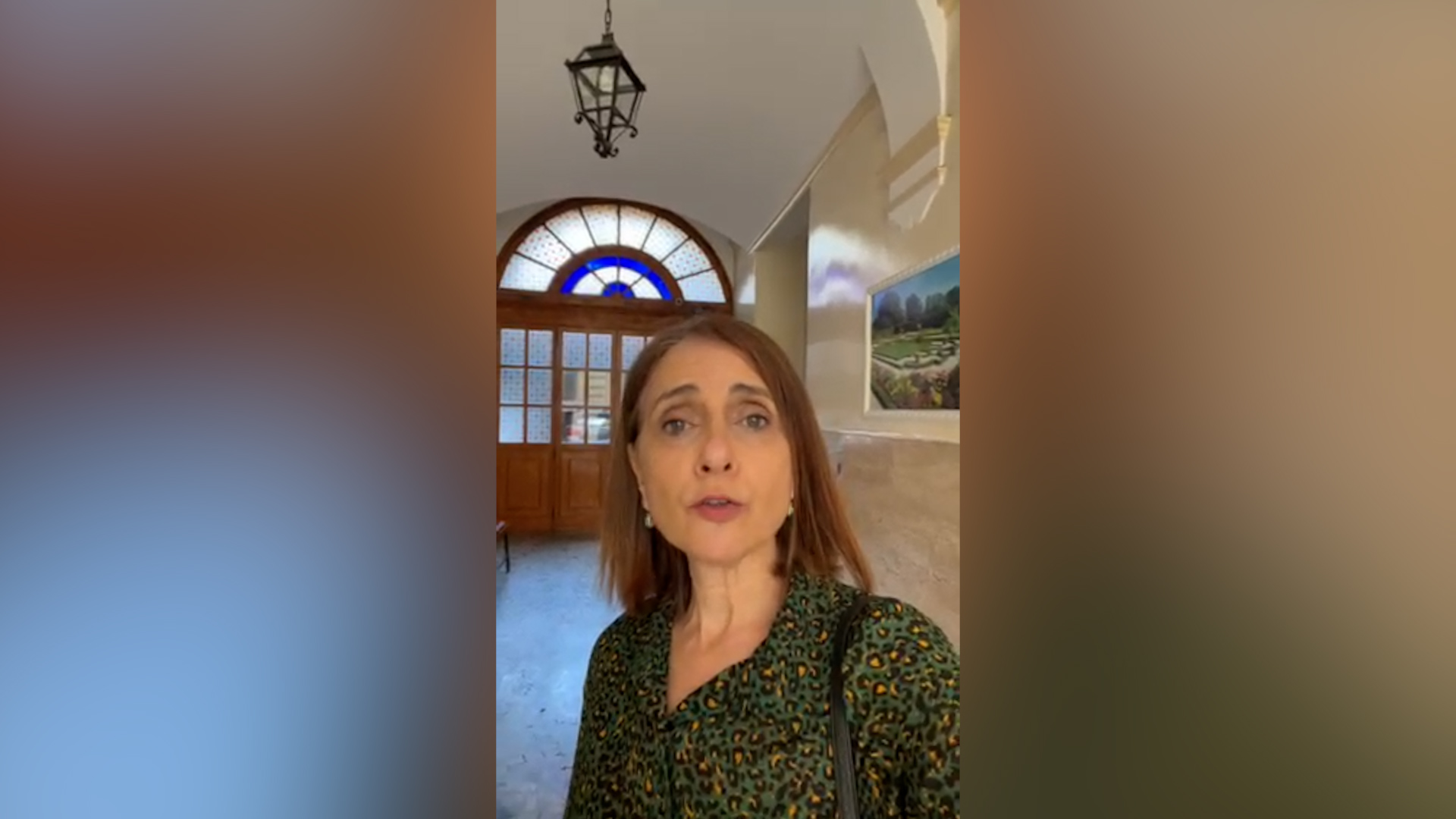 Joyce Ajlouny recording a selfie video indoors