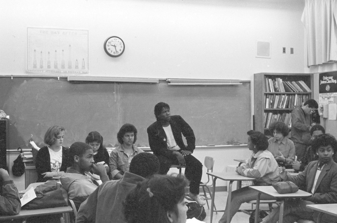 Group of students gathered together in a classroom