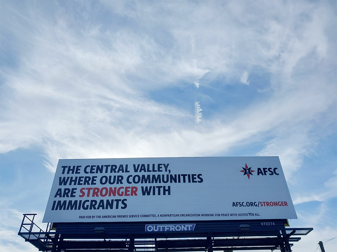 big billboard with text that says the Central Valley, where our communities are stronger with immigrants, afsc