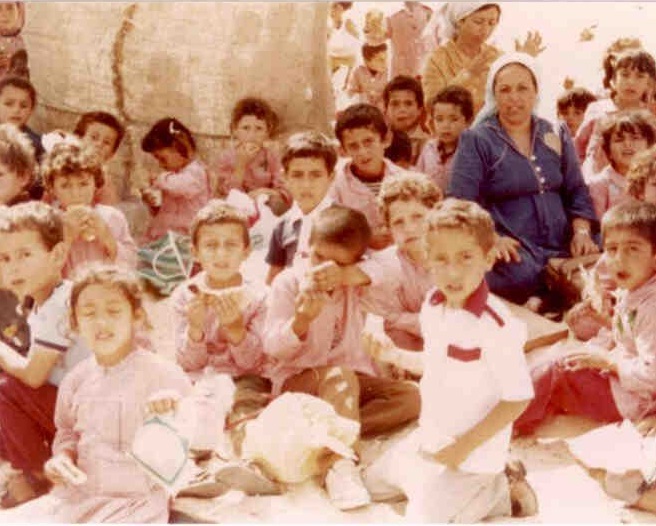 Group of children sitting together outside