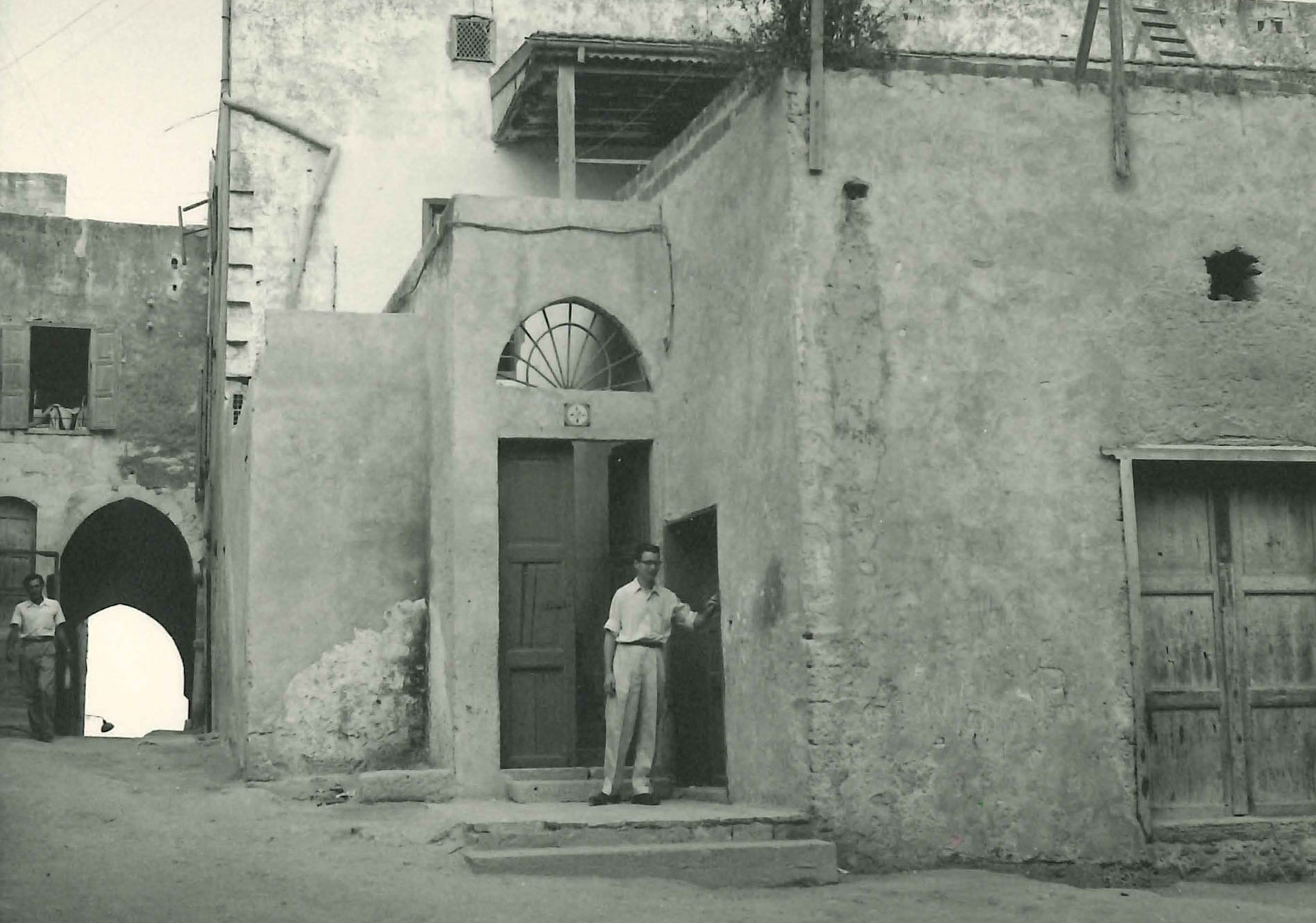 Man standing outside a building in Akka