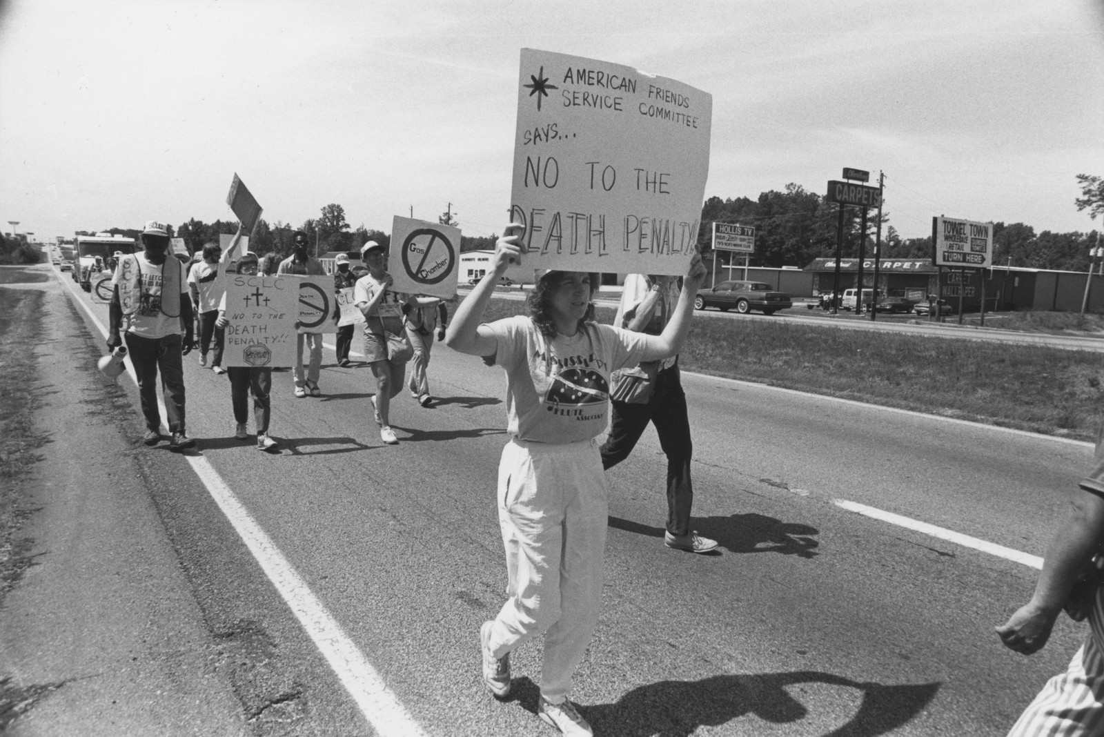 Black and white photo of people marching against the death penalty