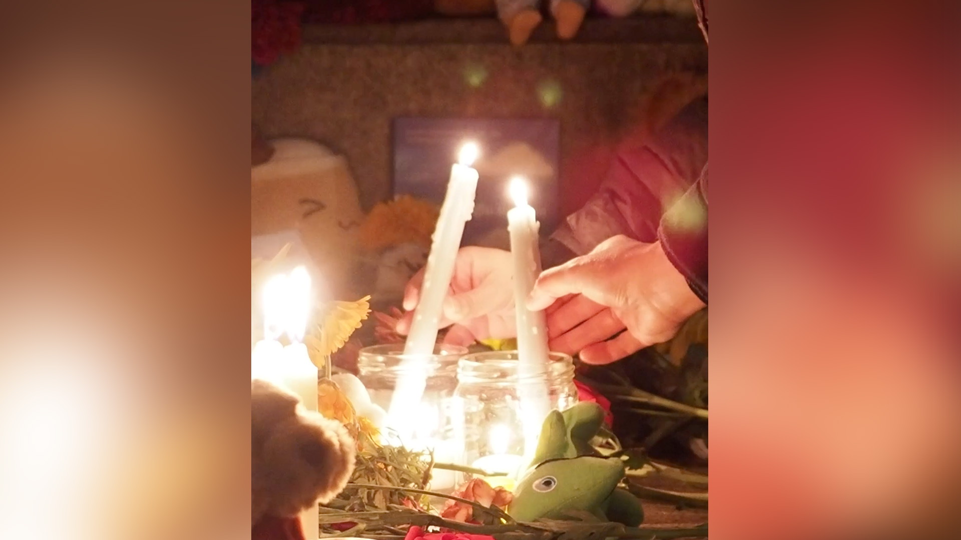 Two candles in a memorial at night