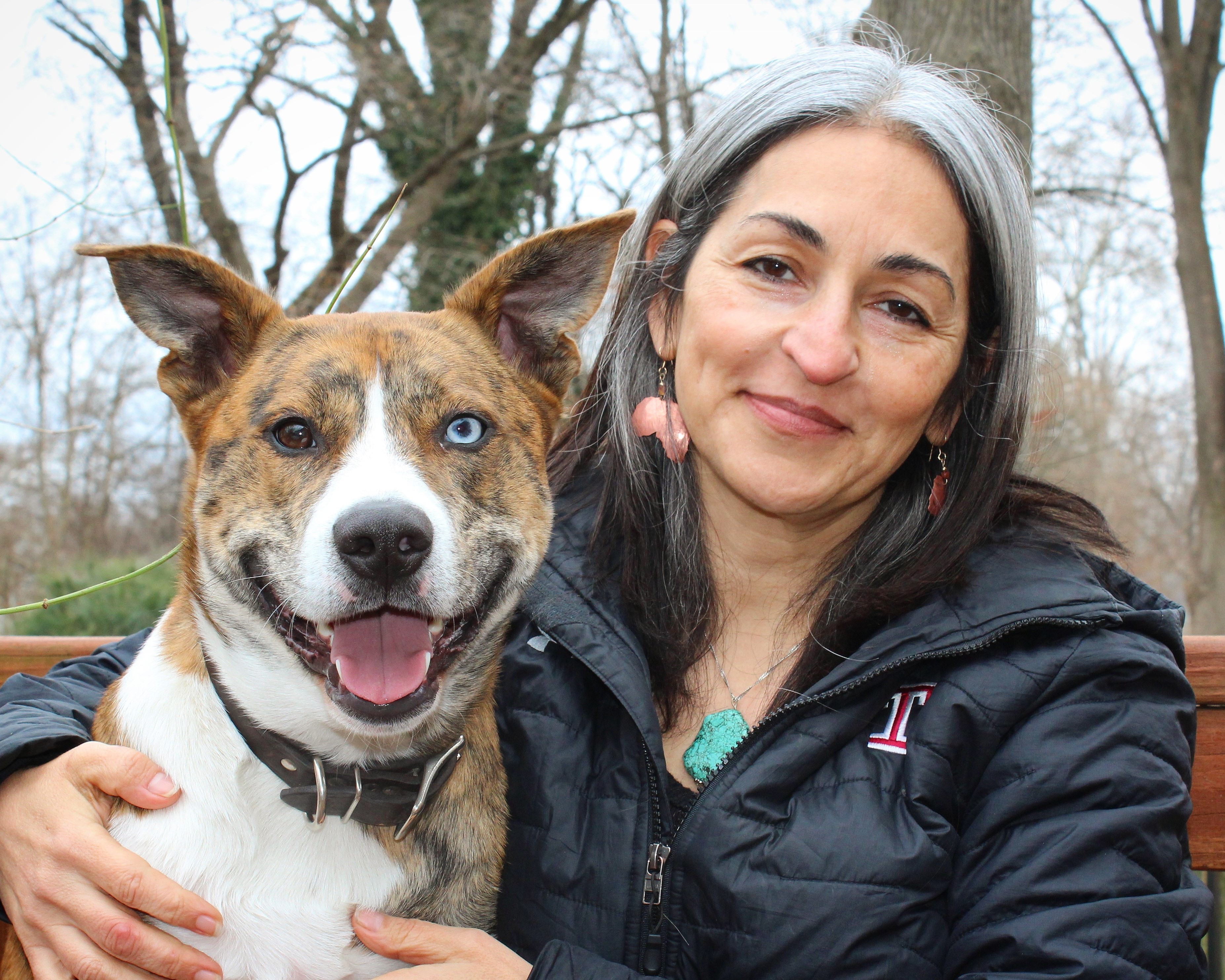 Headshot of susan abulhawa with her dog