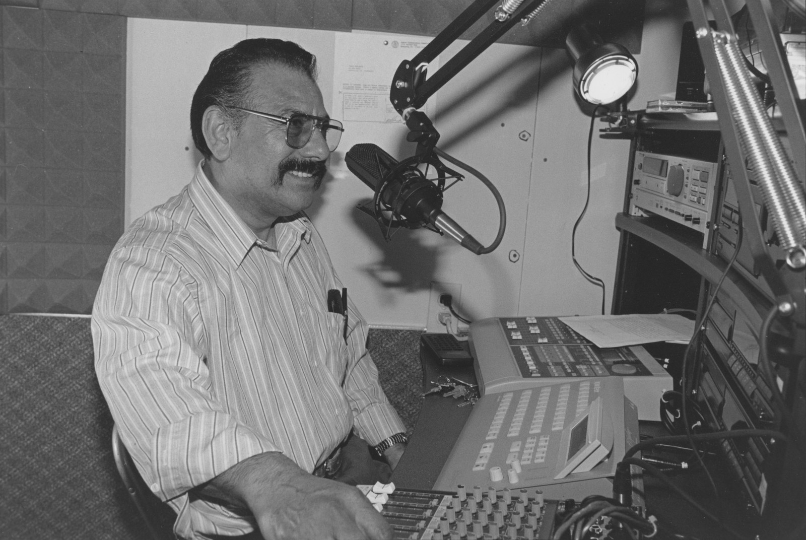 Man speaking in front of a microphone