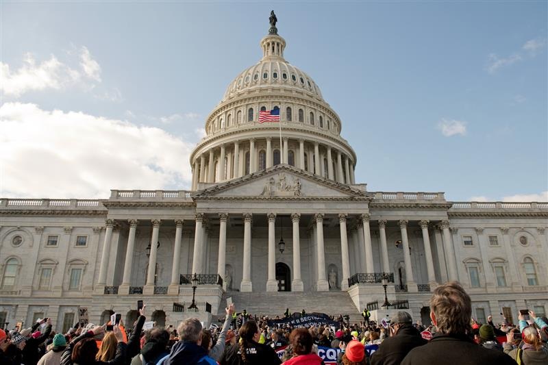 U.S. Capitol with a crowd in front of it