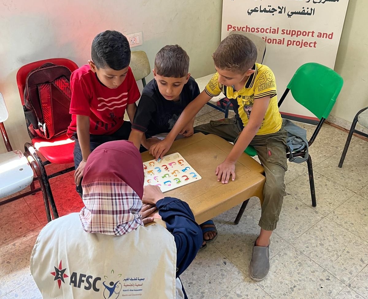 Karim (left) took part in AFSC's educational initiatives, which support children who have been deprived of schooling for nearly two years.