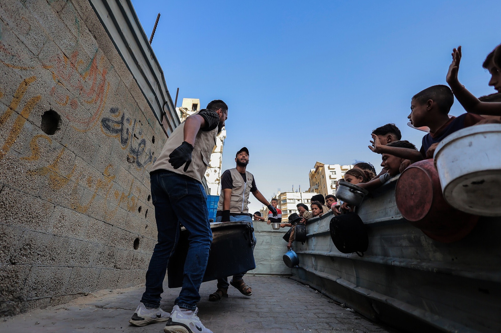 /sites/default/files/2025-09/pb_123001_distributing-hot-meals-in-gaza-scr_team-members.jpg