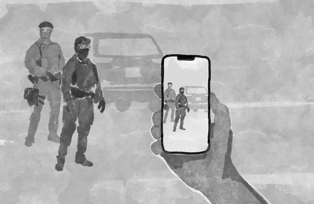 person recording ICE on their phone