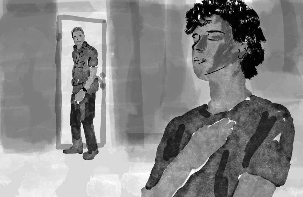 person with hand over chest