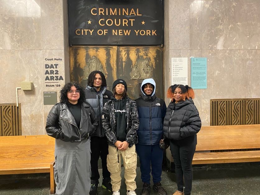 group celebrating graduation from liberation academy