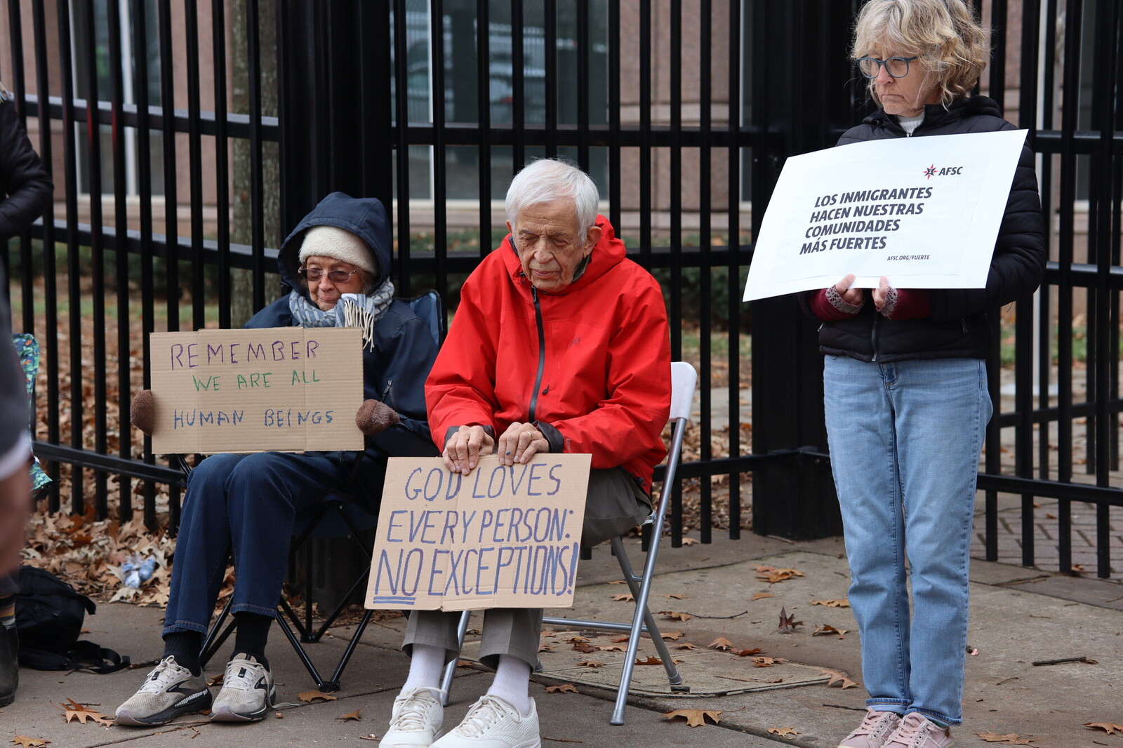Quakers holding signs affirming the dignity of all people during a vigil in Atlanta