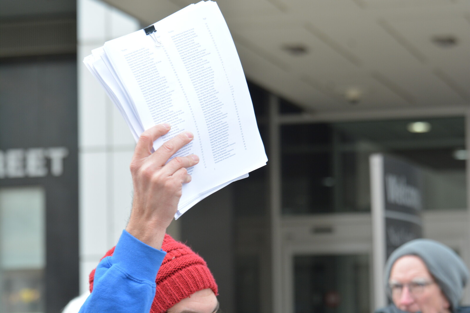 person holding up some papers