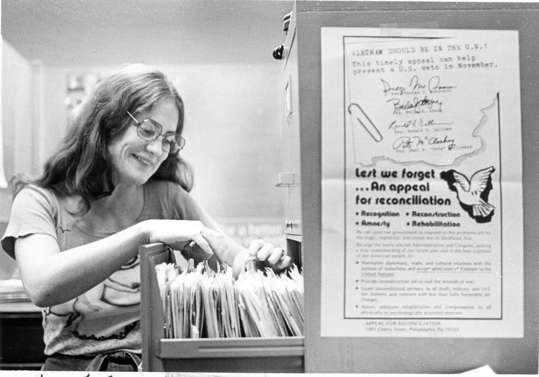 photo of afsc staff lookin through a file cabinet