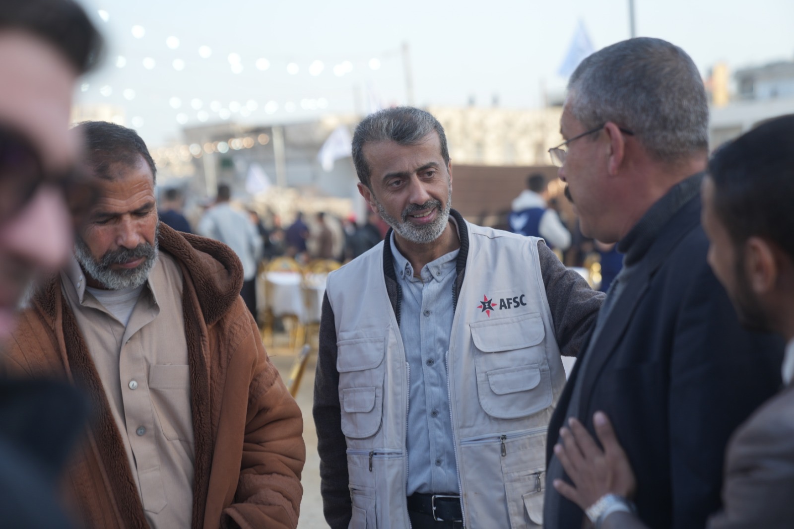 A group of 5 men talk