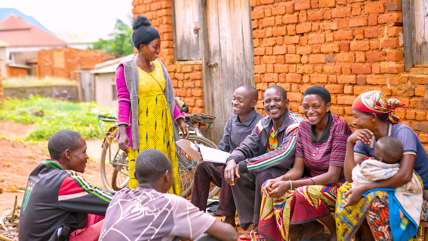 Group of people sitting in a circle outside