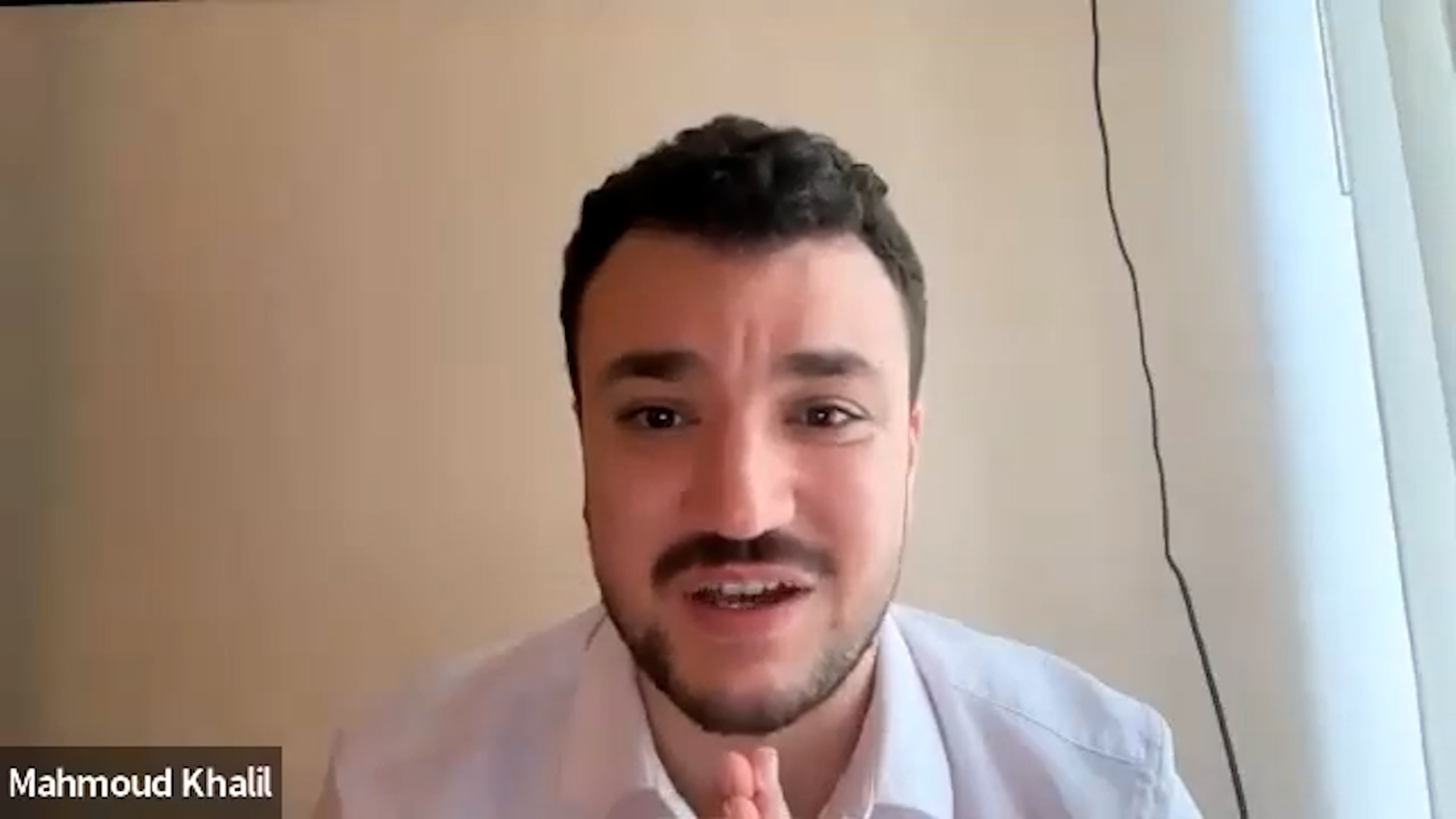 Mahmoud Khalil speaking on a webinar