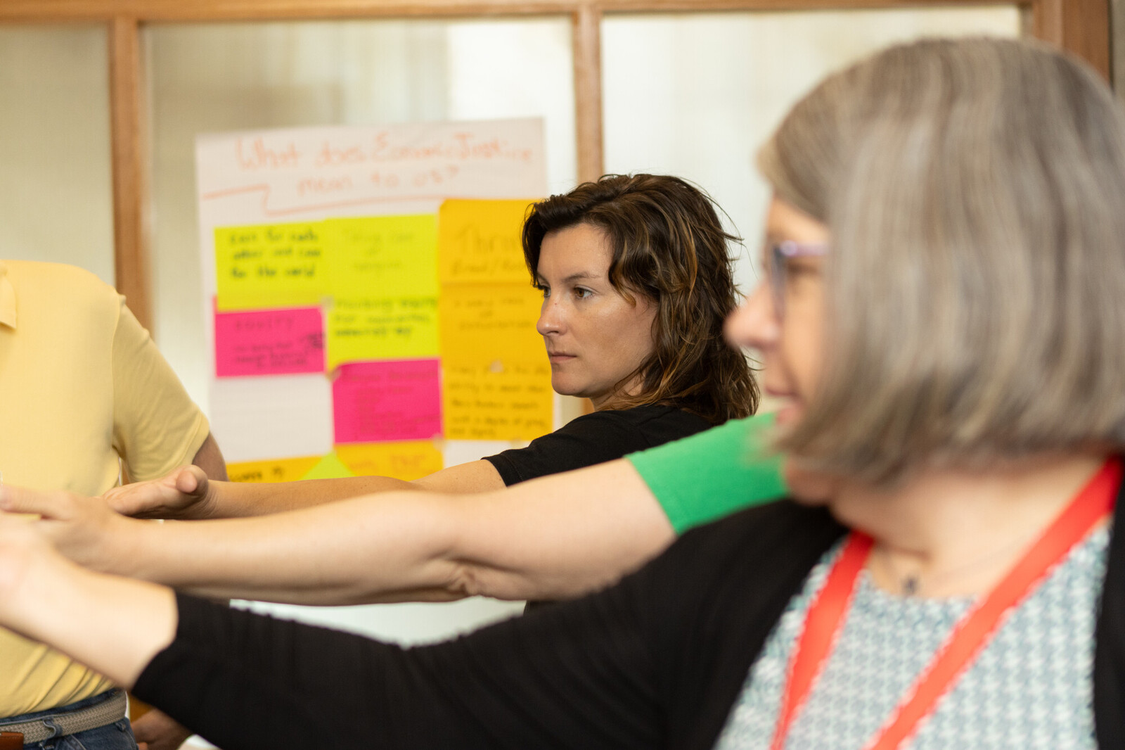 people with their arms in a circle