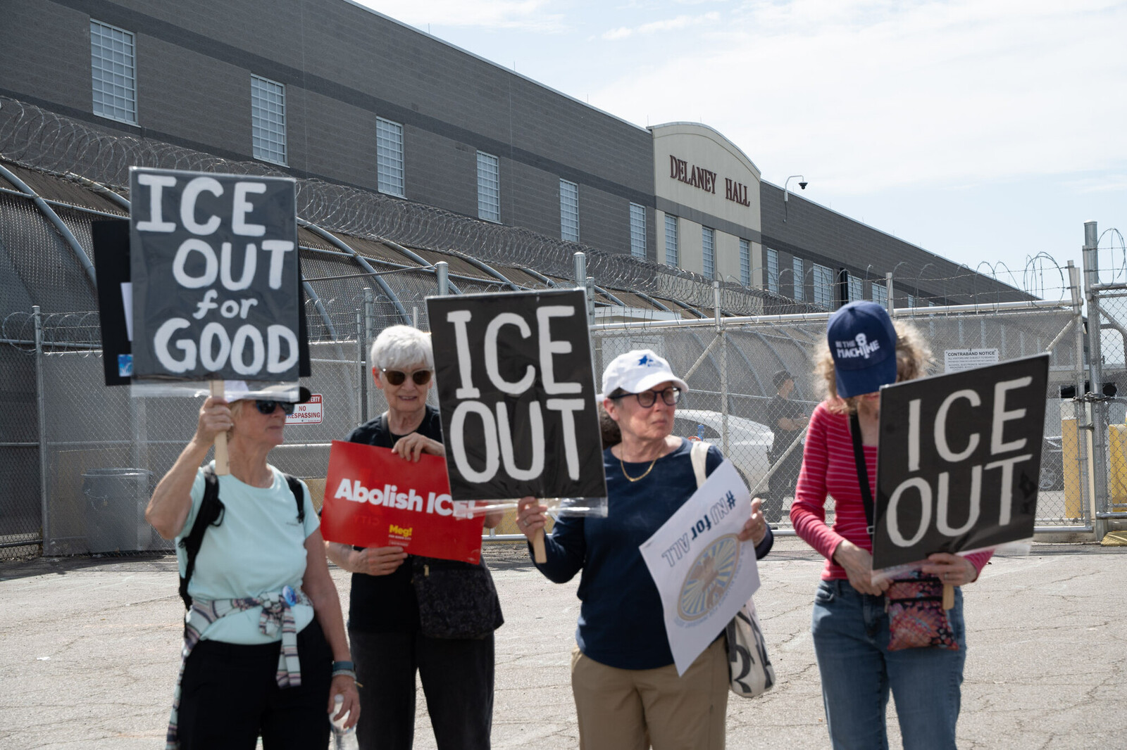 people holding ice out signs