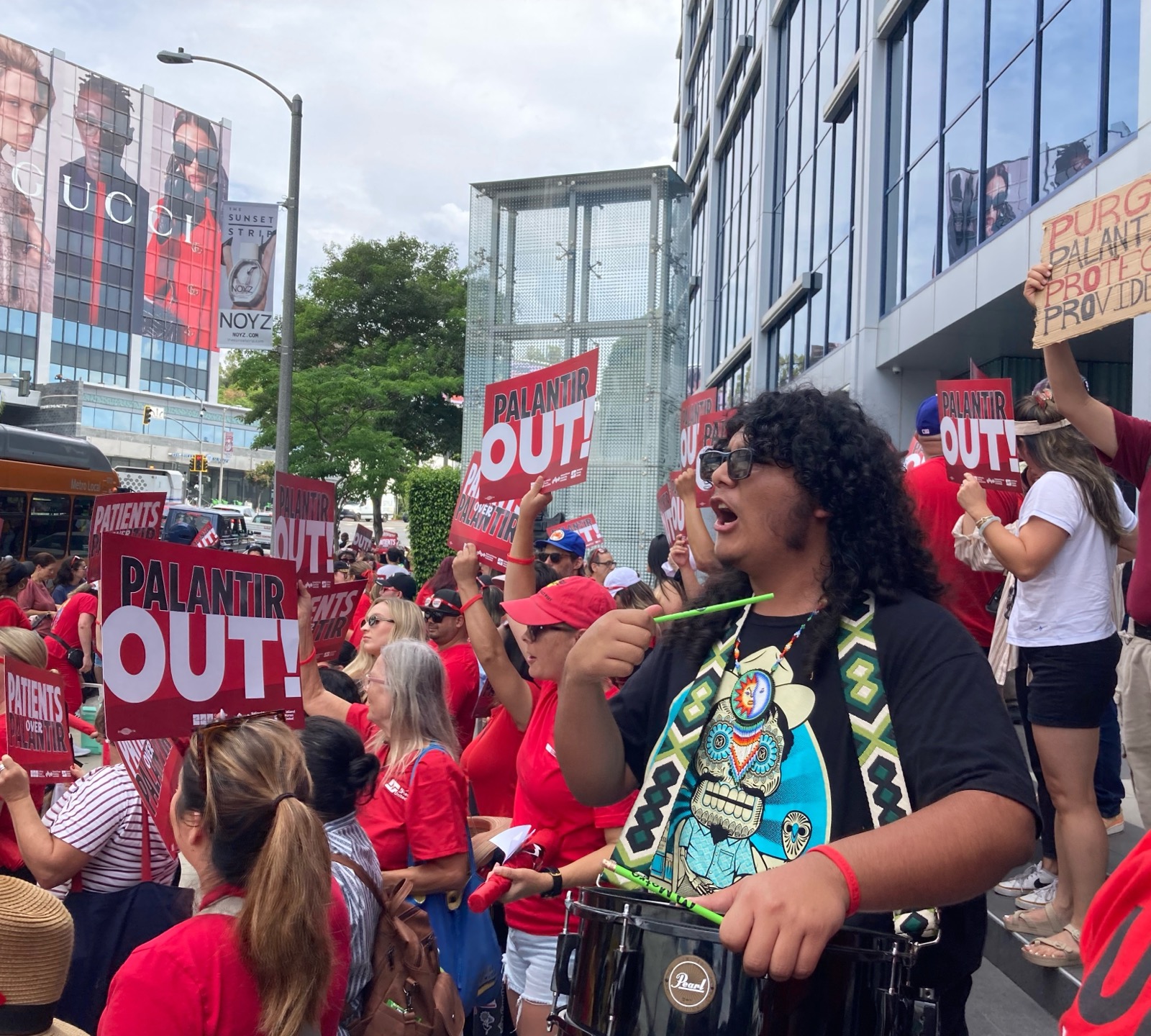 man with drum at Palantir rally