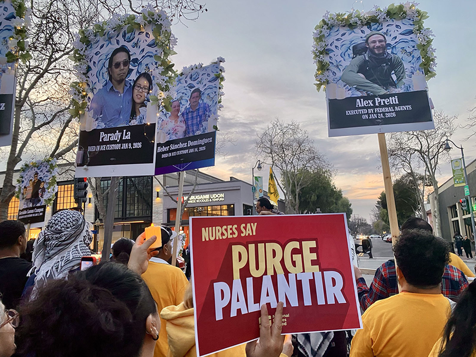 Rally with signs that read 