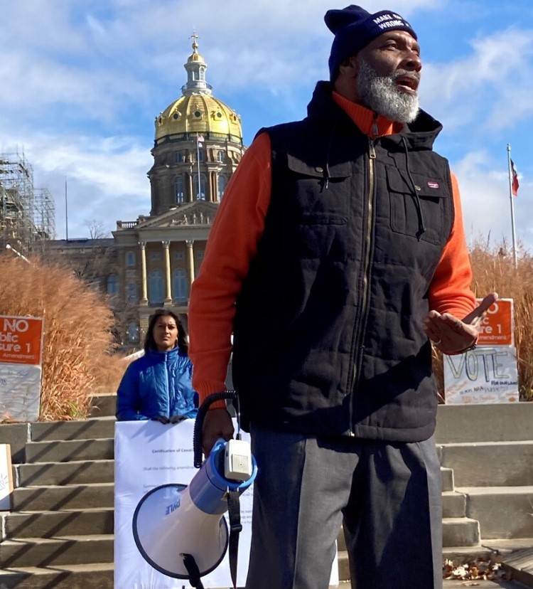 State Rep. Ako Abdul-Samad speaks to a crowd at a rally.