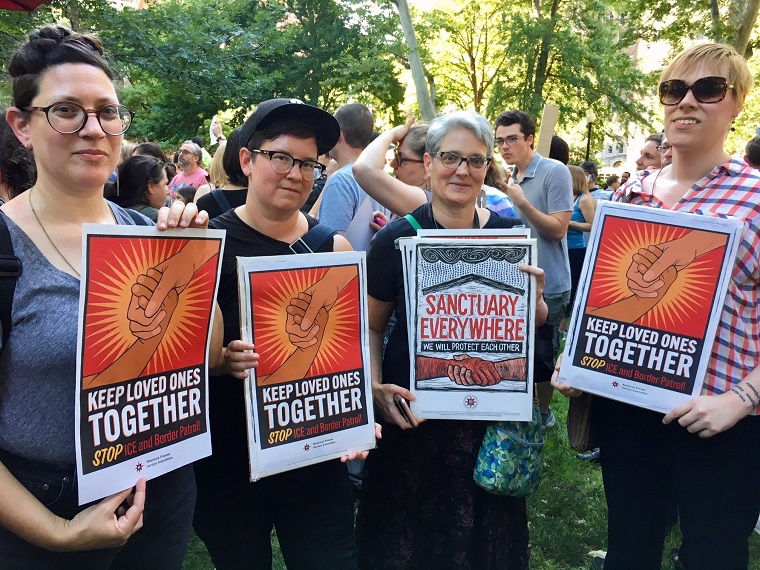 The author and co-workers at a protest in Philadelphia focused on family separation