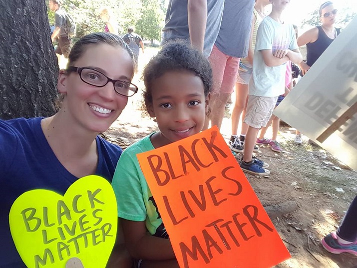 The author with her daughter at the protest in Charlotte