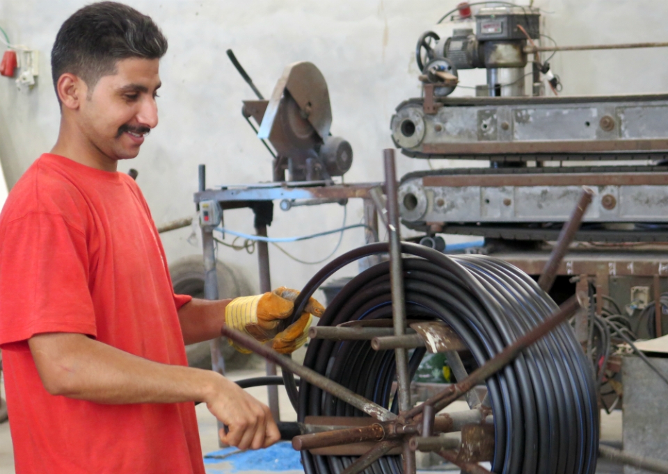 One of 12 factory workers employed by Naser and Ismael Ramlawi. Photo: AFSC/Mike Merryman-Lotze