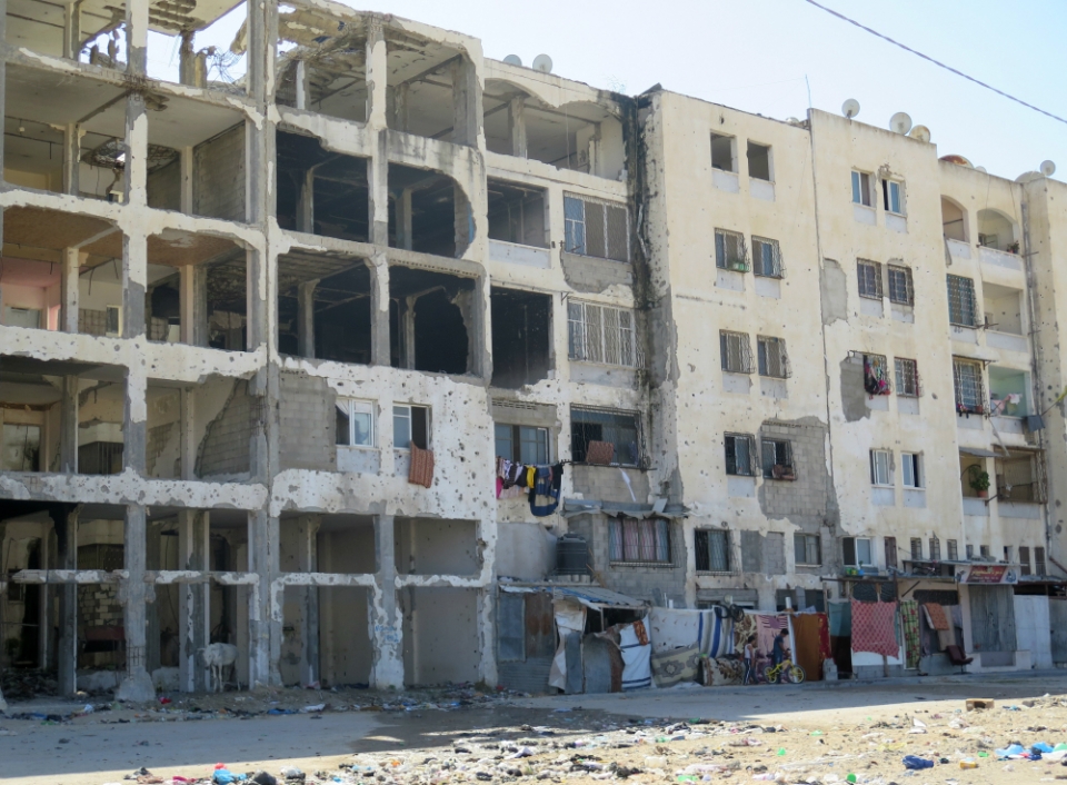 Many structures damaged during the 2014 Gaza war, including this apartment block, remain in ruins today. Photo: AFSC/Mike Merryman-Lotze