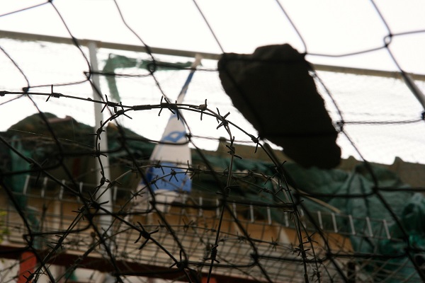 A rock caught on the wire mesh that protects Palestinians shops from debris thrown from Israeli settlements above.