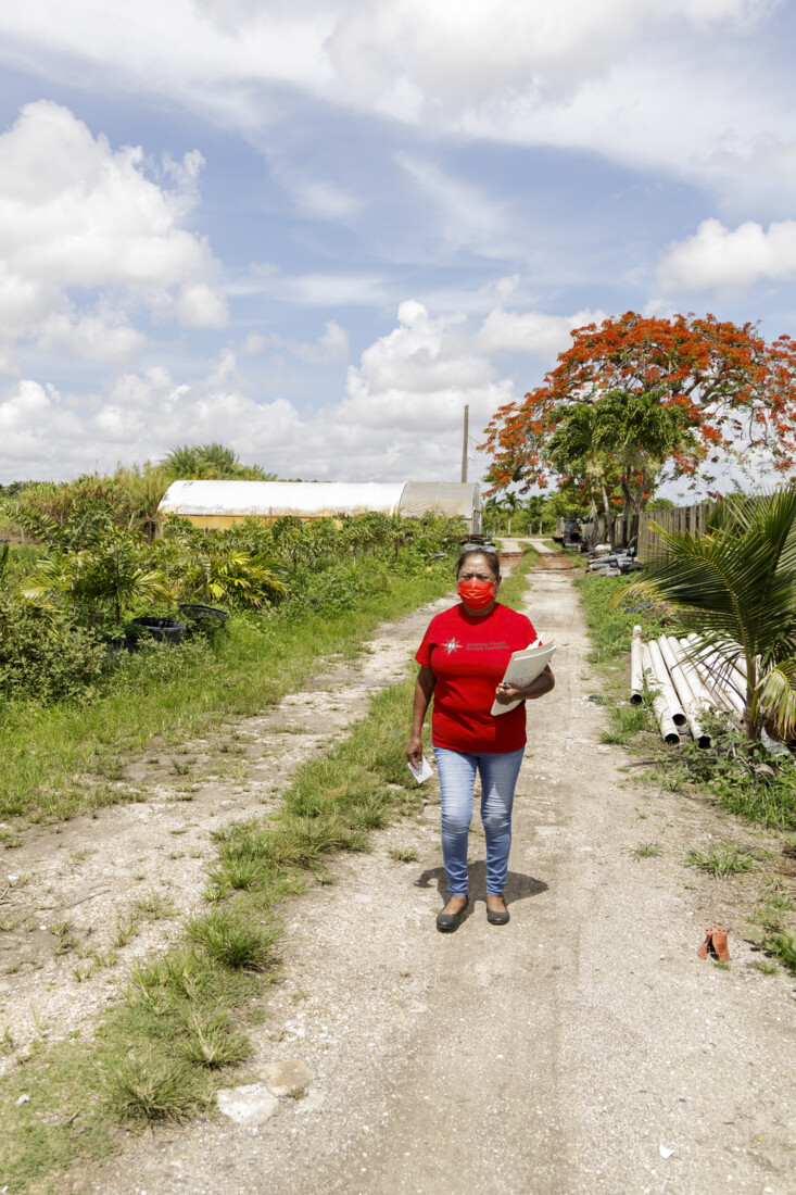 AFSC volunteer Antonia goes door to door to encourage farmworkers and their families to get get the COVID-19 vaccine. Photo: Adam Barkan