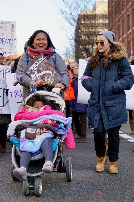 The author (at left) with her daughter in a stroller, at a protest in Philadelphia. Photo: Jeff Fazio Photography