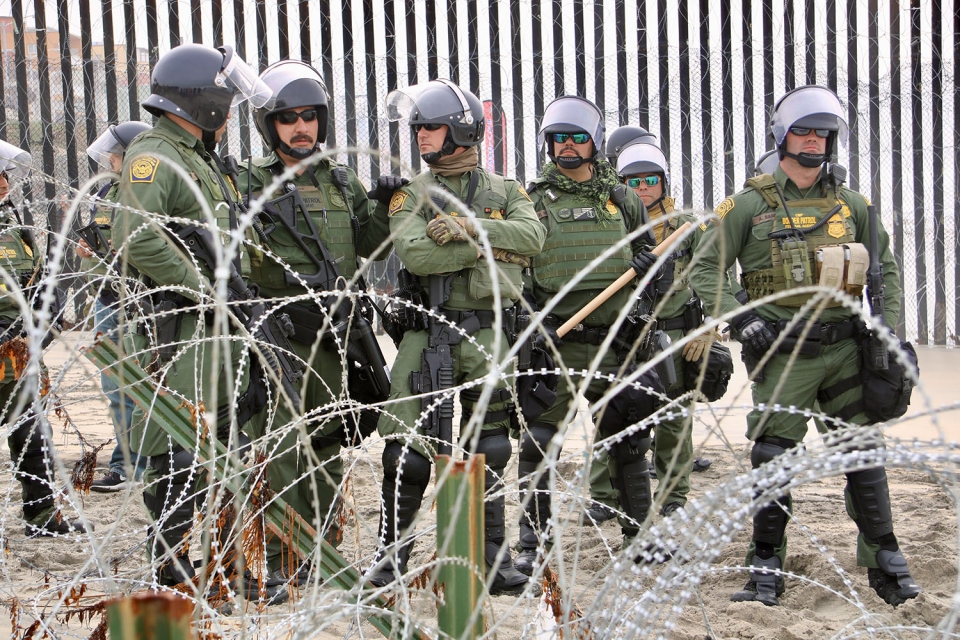Border Patrol agents at the border between San Diego, California and Tijuana, Mexico. Photo: Pedro Rios/AFSC